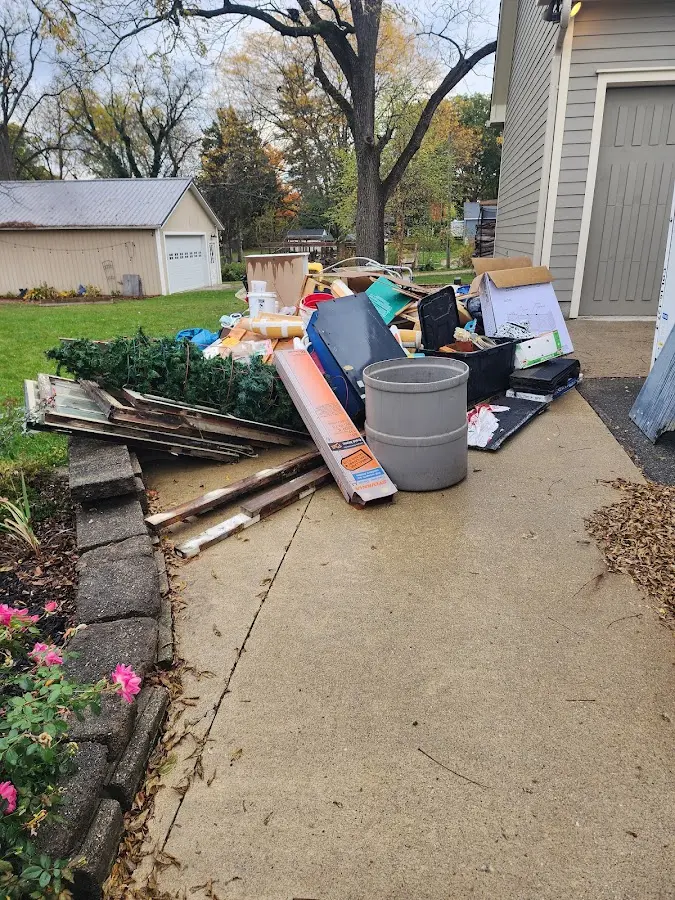 Dumpster being loaded with debris for 3 Yard Dumpster Rental in Rutherfordton